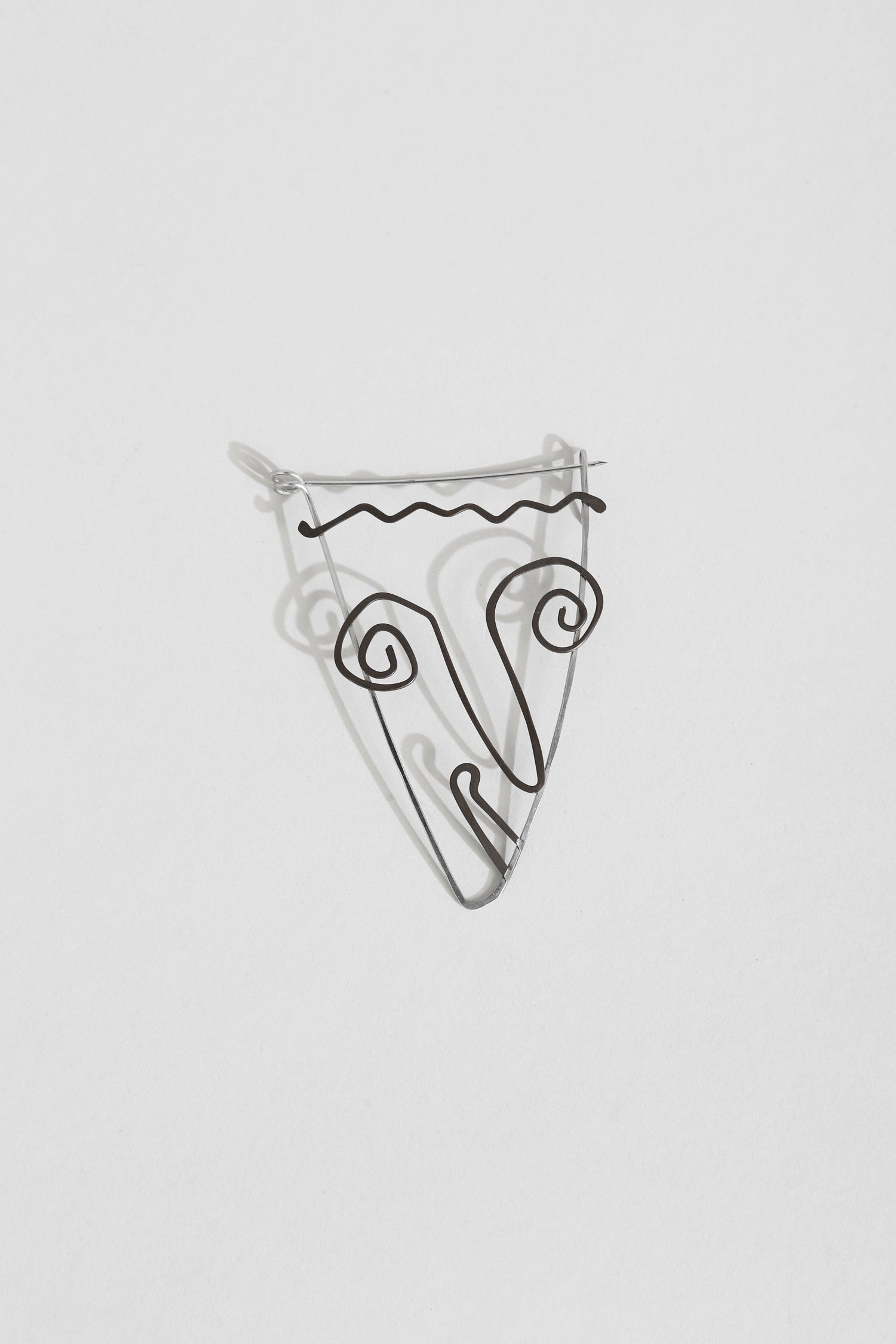 Face Brooch