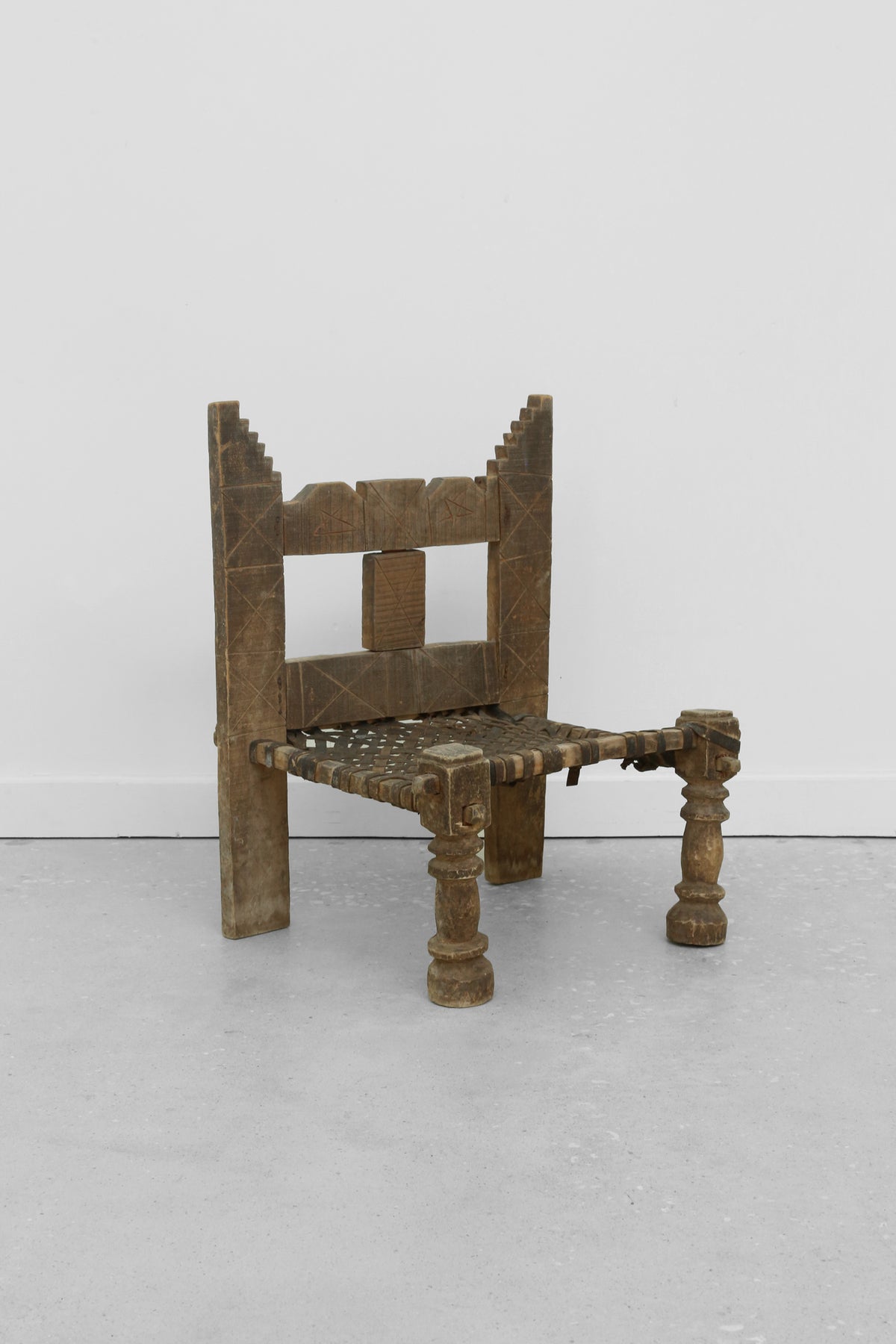 Carved Wood + Woven Leather Chair