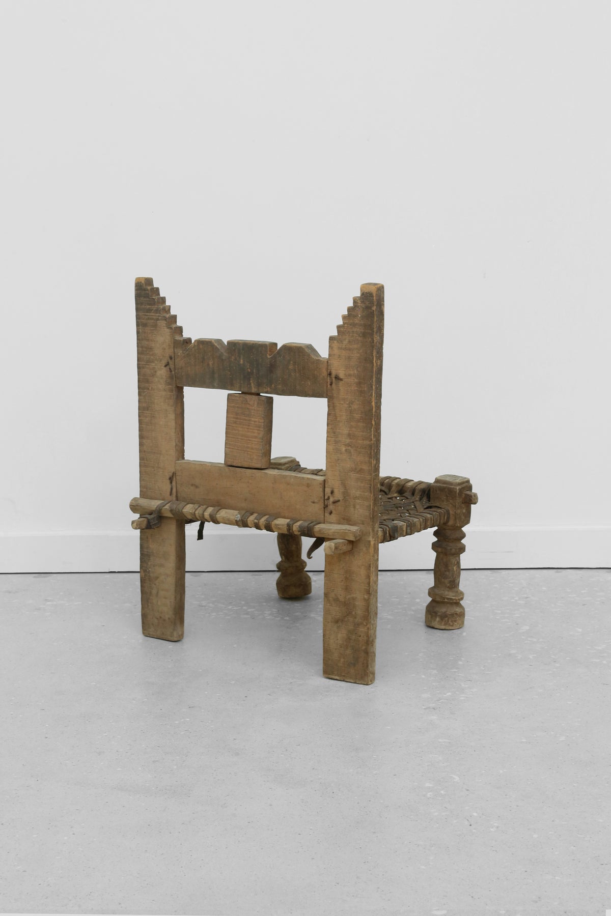 Carved Wood + Woven Leather Chair