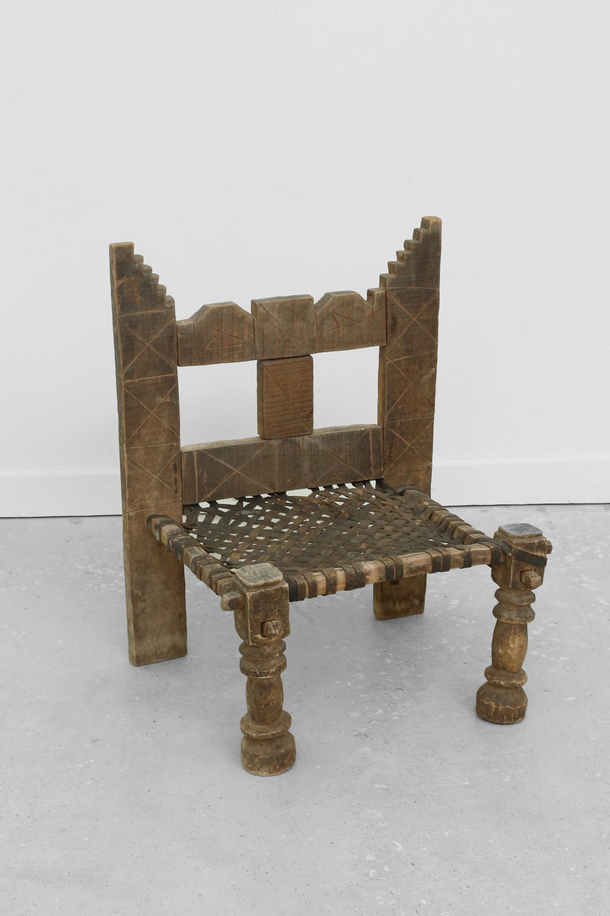 Carved Wood + Woven Leather Chair