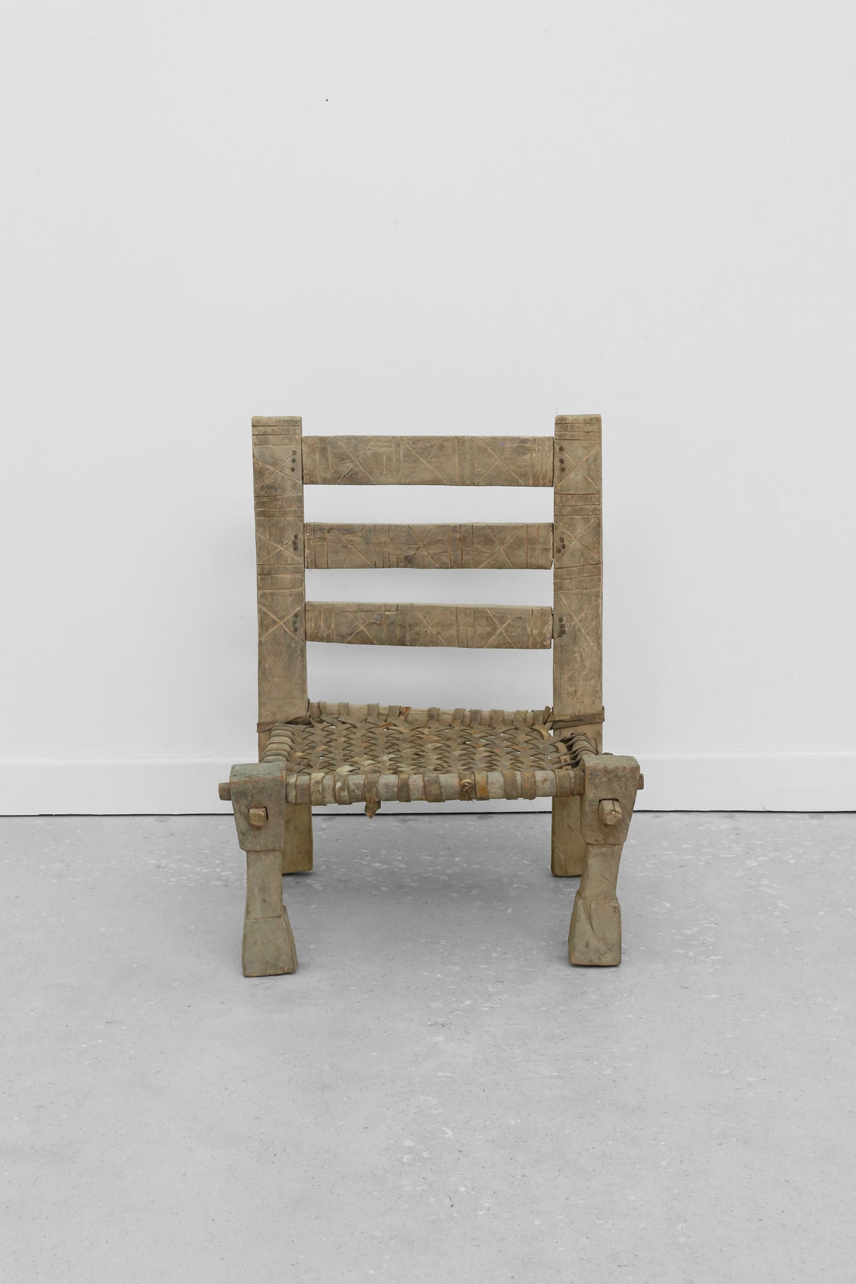 Carved Wood + Woven Leather Chair