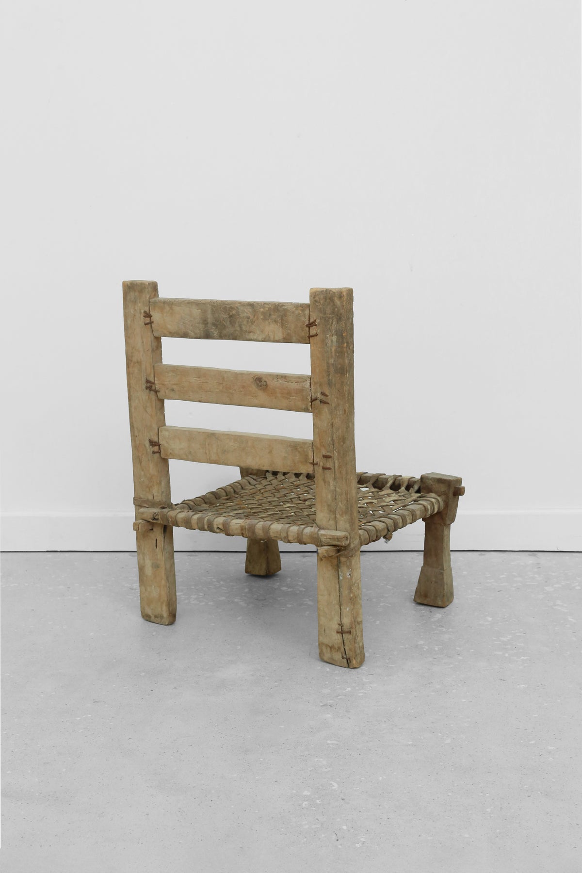 Carved Wood + Woven Leather Chair