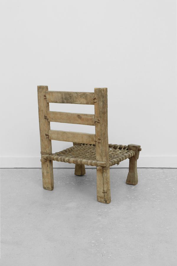 Carved Wood + Woven Leather Chair